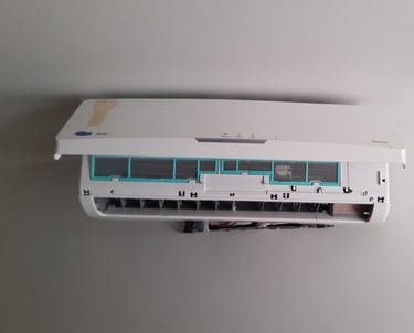 A wall-mounted split system air conditioner unit with its front cover panel open for maintenance and cleaning.