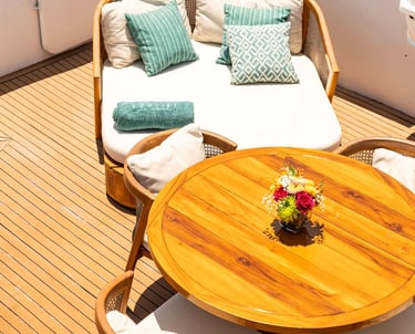 Private yacht outdoor lounge with elegant seating, designed for luxury expedition cruises