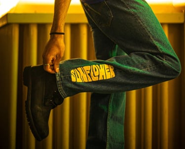 a man in a blue shirt and jeans jeans