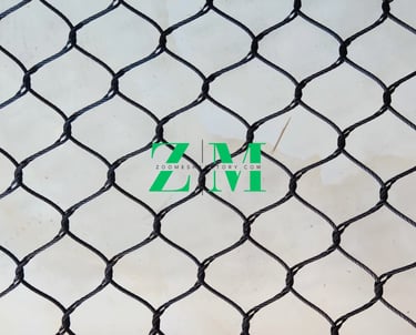 Durable black oxide stainless steel wire rope mesh for safety netting and zoo enclosures.