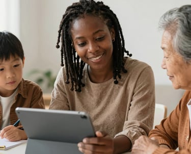Three women interacting indoors with soft lighting.