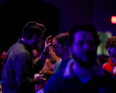 Pastor applying ashes to a congregants forehead