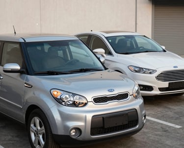 A happy gig driver delivering food with a FamiliaDrive rental car in a bustling neighborhood.