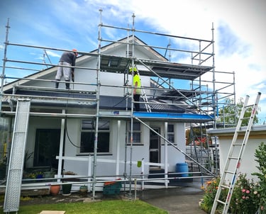 Gee Cee Painting team at work on scaffolding, restoring roof and exterior, with safety, care and precision.