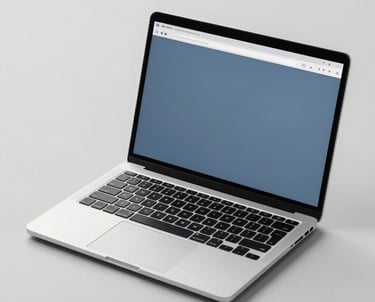 A photograph of a high-end laptop on a clean, light gray surface. The screen shows a minimalist web interface with slate blue accents. The lighting is soft and even, highlighting the professional design. North American studio setting.