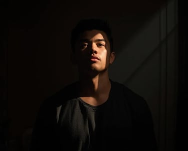 Man in dramatic light and shadow, Thunder Motivation symbolizing inner strength and courage.