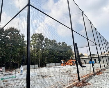 Close-up of durable netting material being measured and cut precisely.