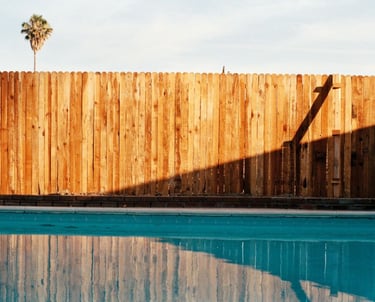 a wooden fenced in pool