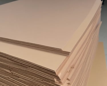 Close-up of sturdy corrugated cardboard boxes stacked neatly in a warehouse.