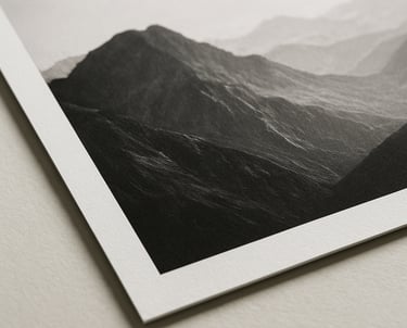 A close-up of a premium photography print showing an abstract mountain landscape in black and white. Timeless and elegant composition.
