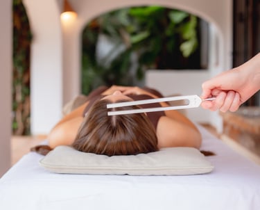 Sheila Doerfler activating client's Sun Star energy center with 174 Hz tuning fork