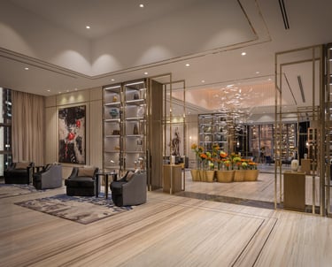 a living room with a couch and a glass wall