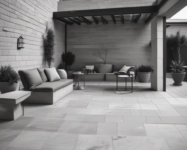 Close-up of hands laying stone pavers in a neat pattern.