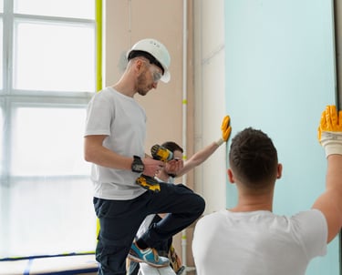 handyman team installing wall panels in an Auckland home