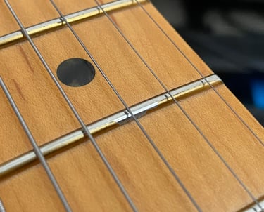 finish over frets - chipping & flaking-off
