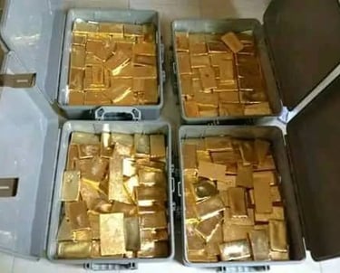 a bunch of gold bars in a box ready to be supplied to gulf countries from gulfgoldmarket.com