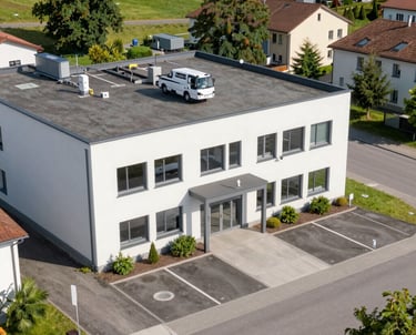 Drone capturing a high-resolution aerial photo of a modern commercial building in Switzerland.