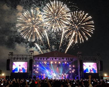 A lively concert stage with musicians performing under colorful lights.