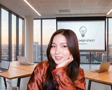 Smiling woman in a modern office workshop setting with a presentation screen and laptops.