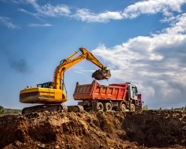 earthmoving and grading contractor preparing commercial construction site foundations Gulf South