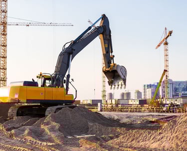 construction site preparation with excavator for commercial development