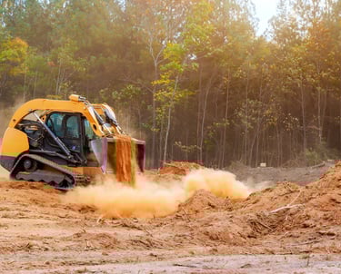 commercial land clearing and site preparation equipment working Gulf South construction site