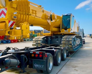 heavy equipment transport between construction job sites 