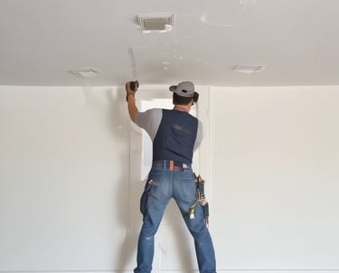 A handyman fixing a leaky faucet in a cozy kitchen.