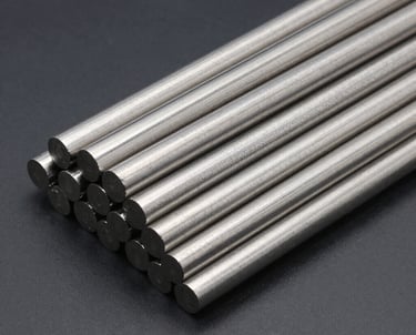 Cinematic shot of polished stainless steel rods shining under red-tinted industrial lighting.