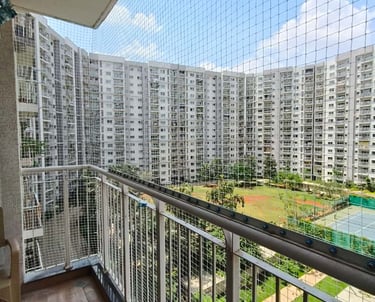 A close-up photo of a securely installed balcony safety net on a residential building in T Nagar.