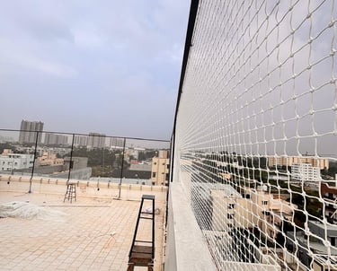 A freshly installed cricket net setup on a sunny day in a Chennai sports ground.