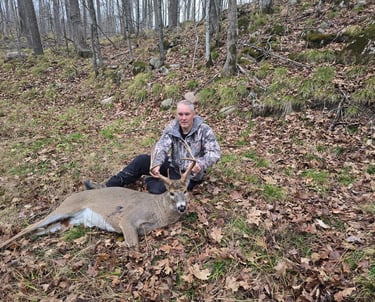 Hunter With a Recovered Deer