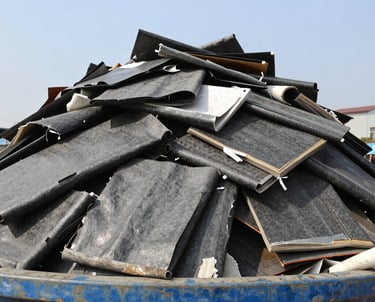 Construction debris and soil piled next to a Solidus rental container on a building site.