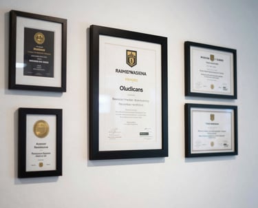 A clean shot of a white wall with several framed marketing awards and certificates. The lighting is soft and professional, highlighting achievement.