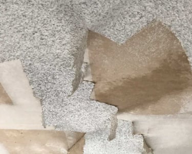 scraping off popcorn texture