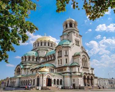 The Alexander Nevsky Cathedral in Sofia, Bulgaria, featuring gold domes and Neo-Byzantine architecture.