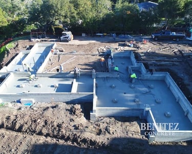 Crew working on large residential concrete foundation