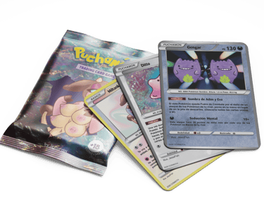 Custom Puchamon trading cards featuring Gengar and Miltank next to a holographic booster pack.