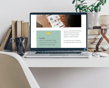 a laptop computer sitting on a desk with the time audit freebie on the screen