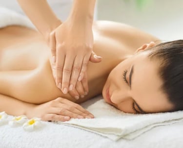 A relaxed woman receiving a professional back massage at Spirit Zen Soul Therapy