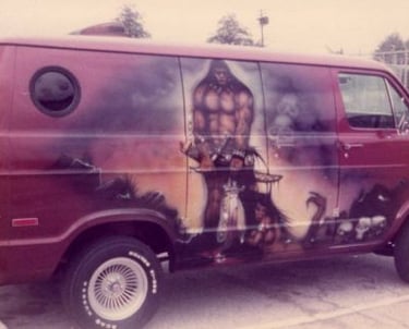 a van with a painting of a man on it