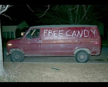a vandalized van with free candy on the side