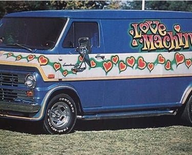 a van with Love Machine message
