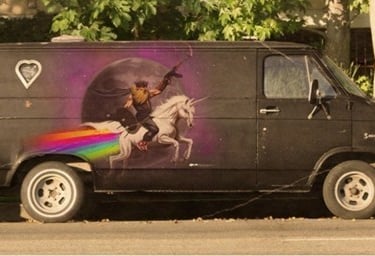 a van with a picture of a man on a horse