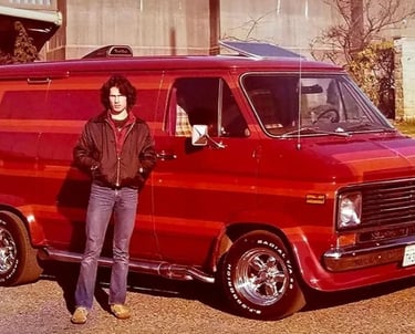 a man standing next to a van