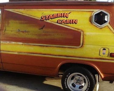 a van with Stabbin Cabin on the side of it