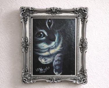 Framed oil painting of a bengal cat in moody lighting