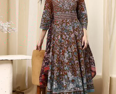 Woman wearing a brown floral print Anarkali kurta set with matching dupatta and churidar leggings.