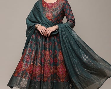 Woman wearing an elegant teal and maroon floral Anarkali suit with a matching dupatta.