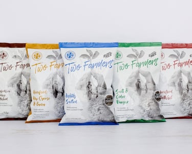 a variety of dog food bags on a white table
